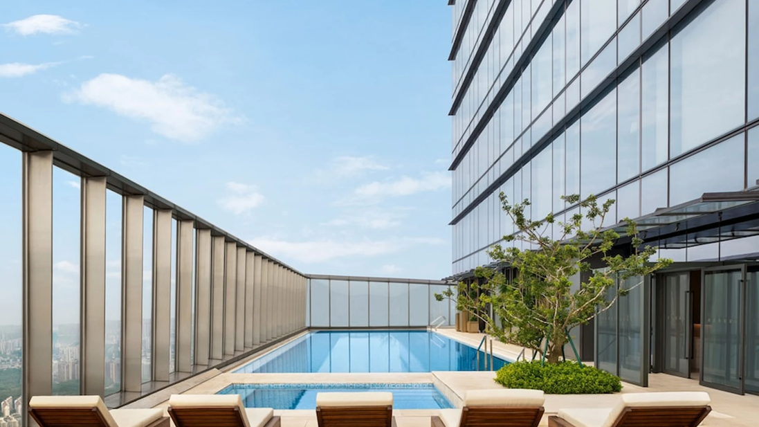 Poolside loungers with skyline views