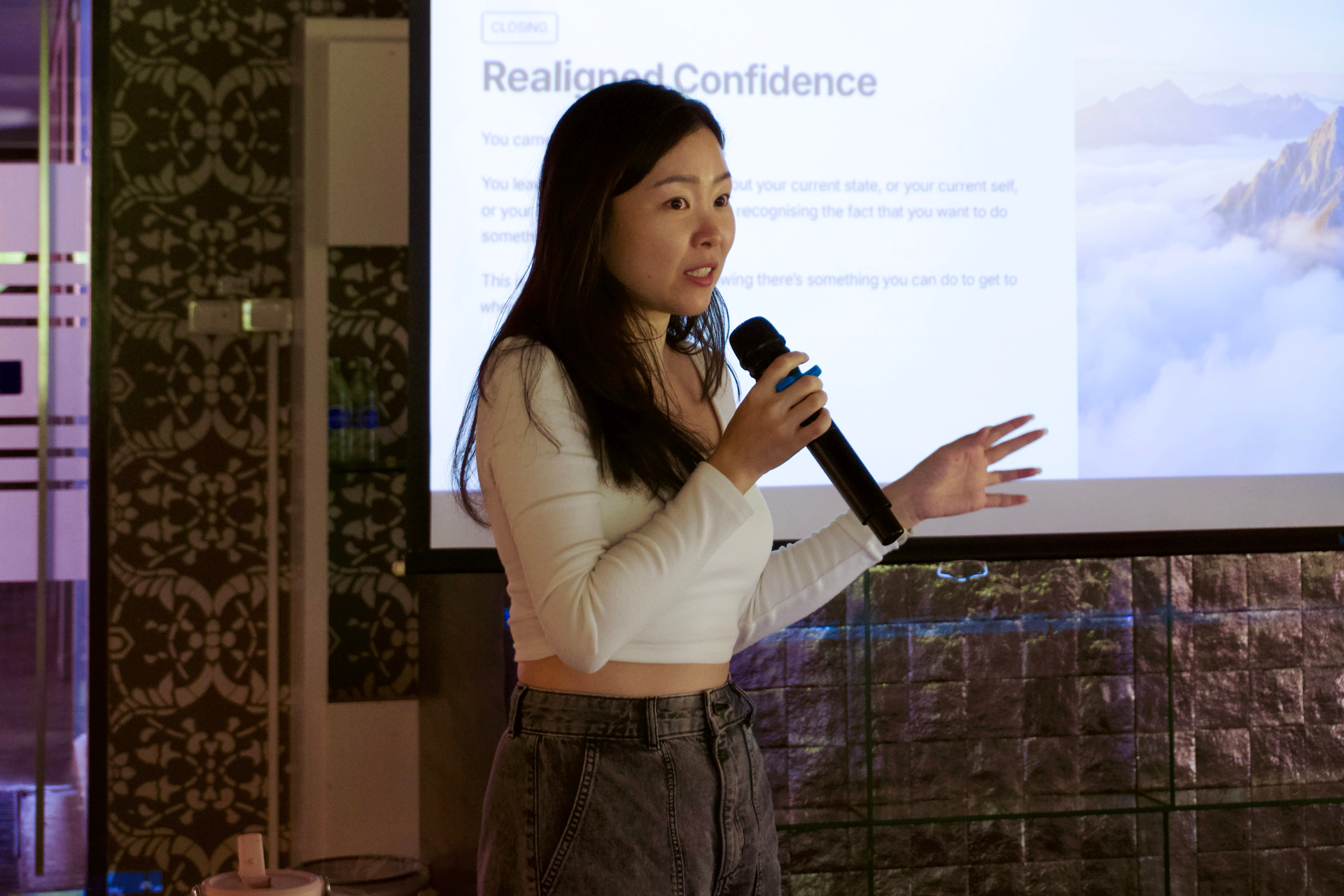 Facilitator speaking to the group with a microphone